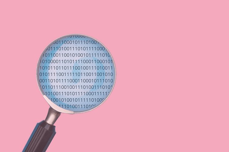 Magnifying glass with zeroes and ones within